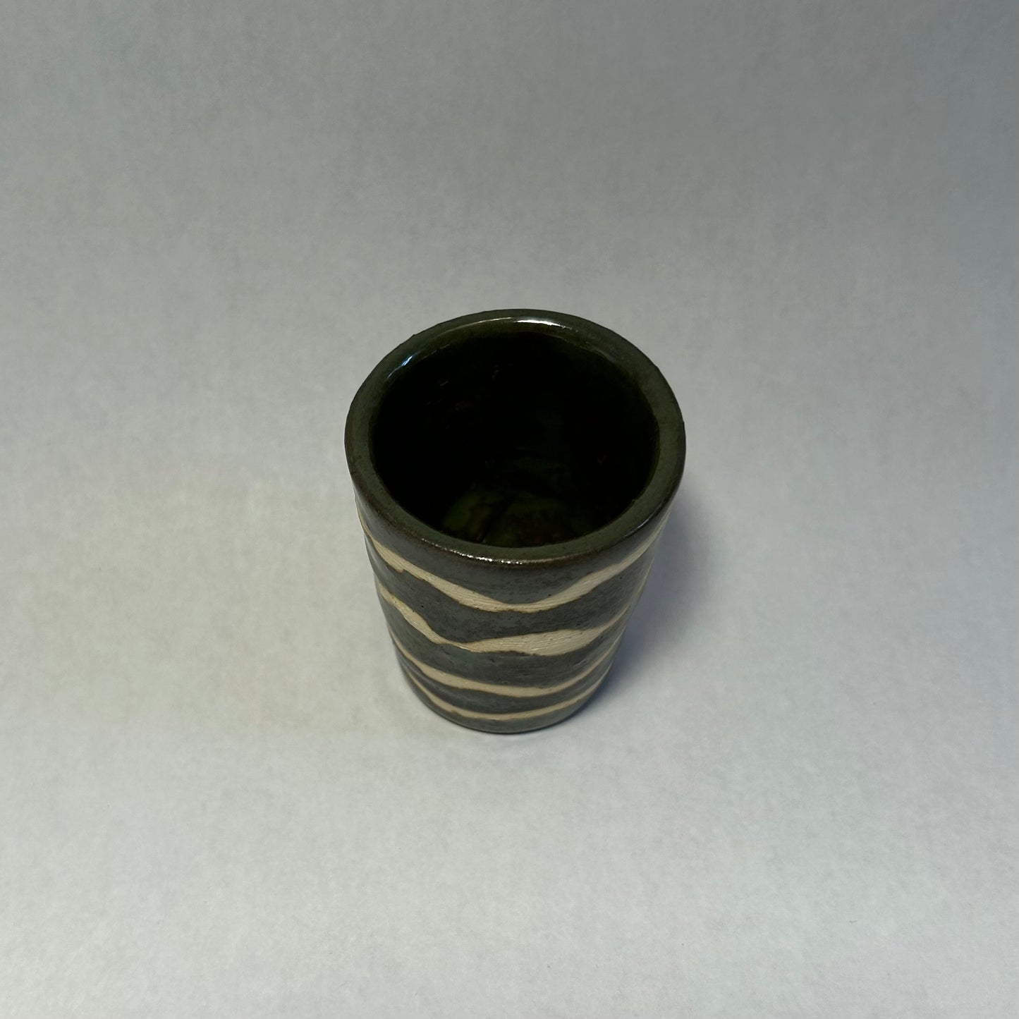 dark green squiggly shot glass