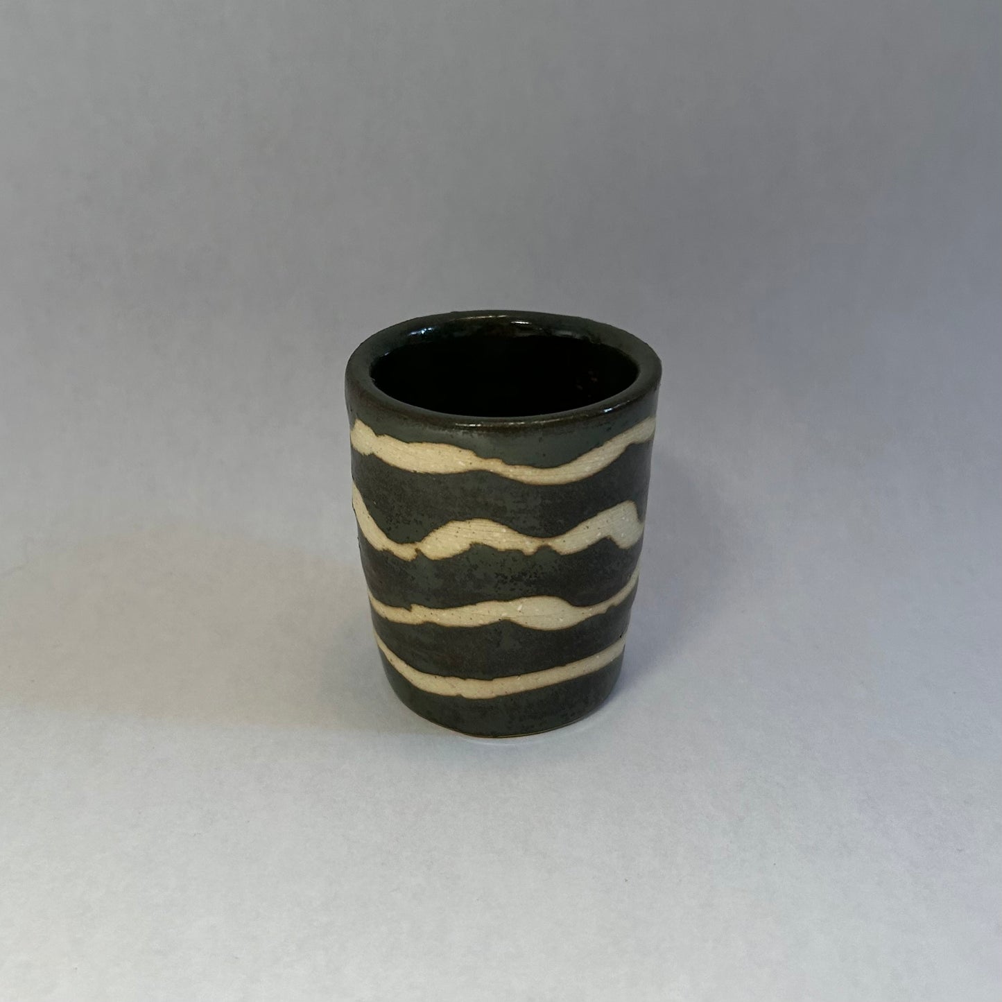 dark green squiggly shot glass