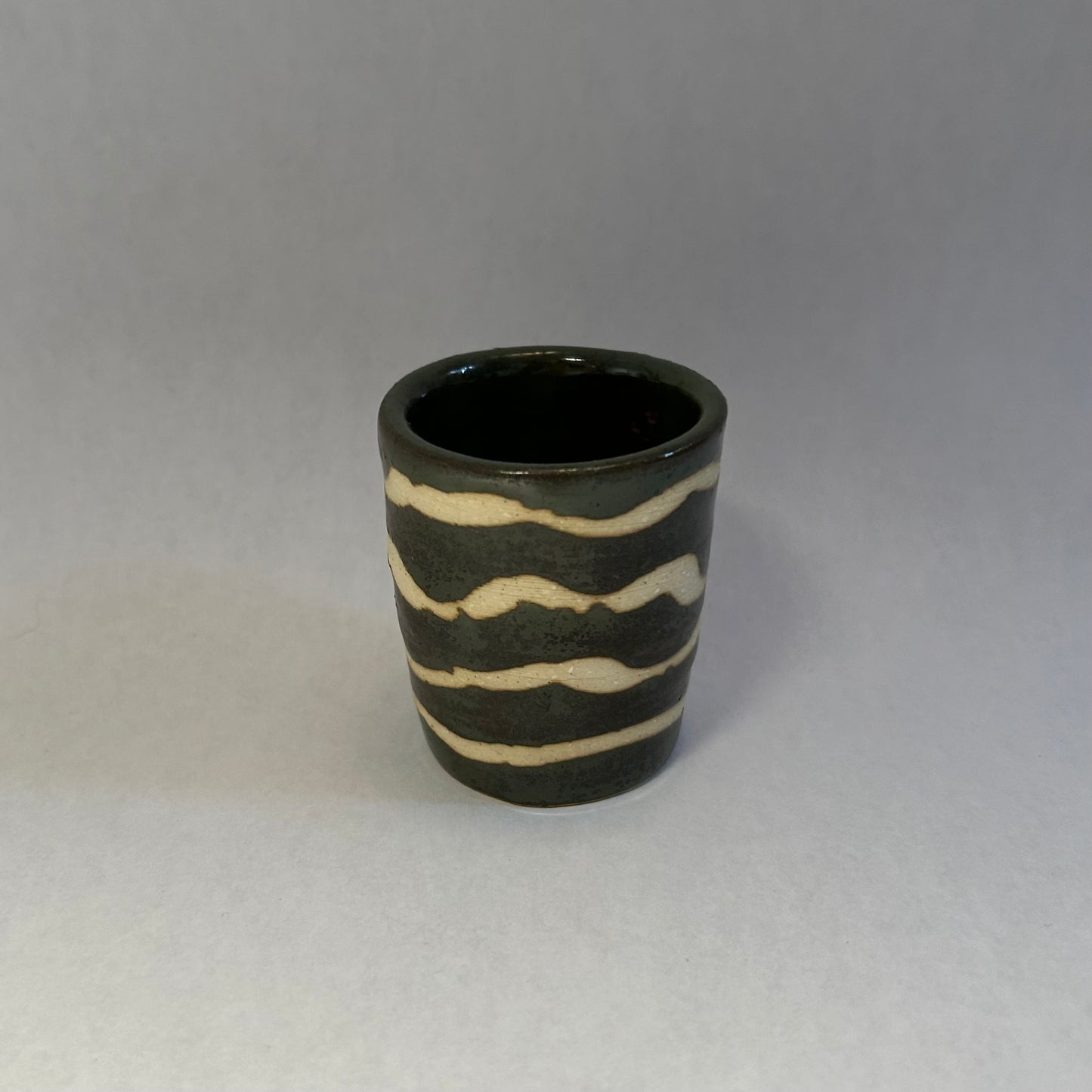 dark green squiggly shot glass